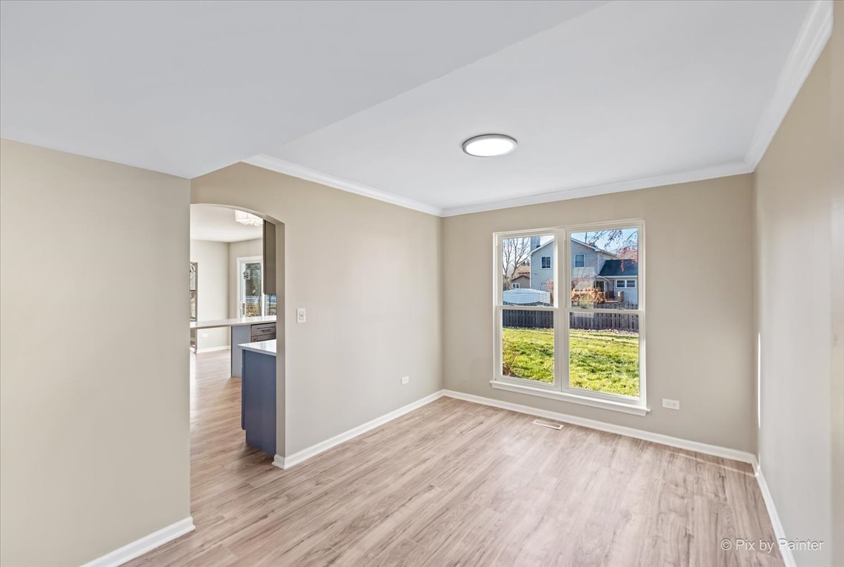 2004 Clematis Drive Algonquin, IL 60102 - Photo 24 of 44 wooden floor in an empty room with a window
