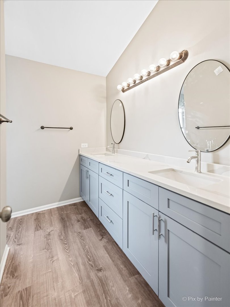 2004 Clematis Drive Algonquin, IL 60102 - Photo 27 of 44 a bathroom with a double vanity sink and a mirror