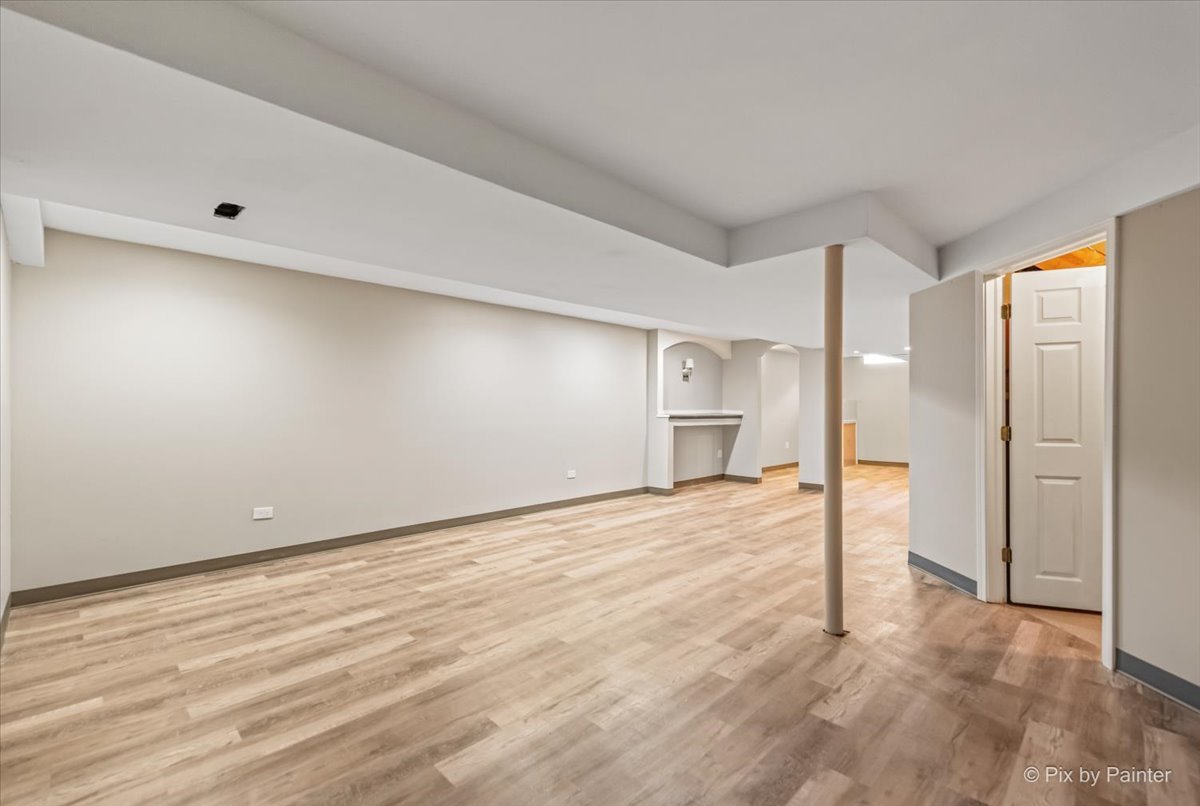 2004 Clematis Drive Algonquin, IL 60102 - Photo 34 of 44 a view of an empty room with wooden floor and a window