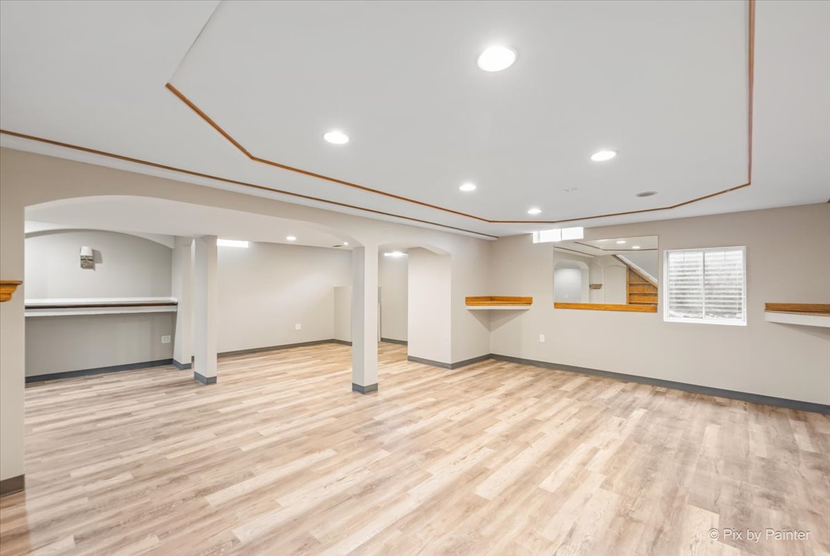 2004 Clematis Drive Algonquin, IL 60102 - Photo 35 of 44 an empty room with wooden floor and windows