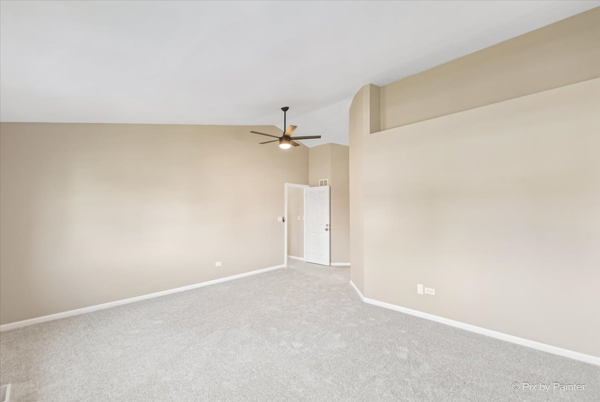 2004 Clematis Drive Algonquin, IL 60102 - Photo 8 of 44 an empty room with a ceiling fan and window