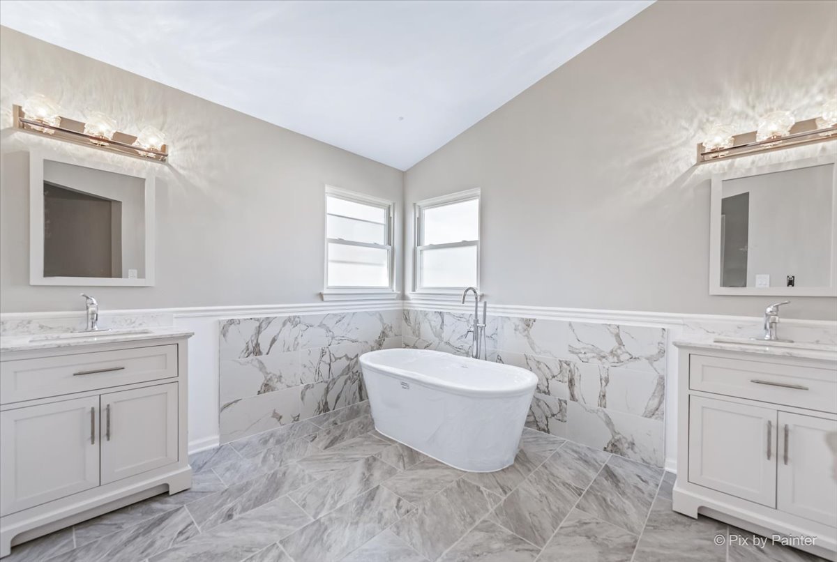 2004 Clematis Drive Algonquin, IL 60102 - Photo 9 of 44 a spacious bathroom with a double vanity sink a mirror and a bathtub