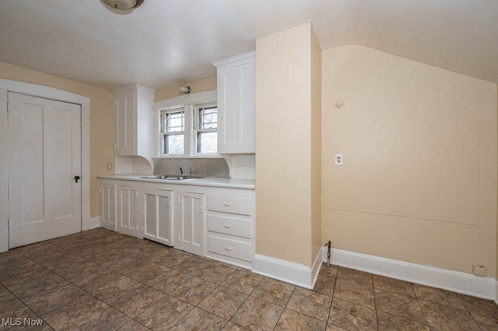 3114 Neosho Road Youngstown, OH 44511 - Photo 7 of 25 2nd floor unit Kitchen with white cabinets and light countertops