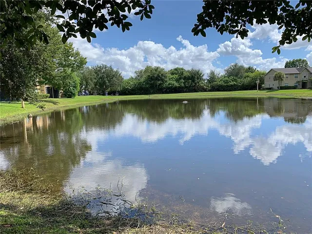 a swimming pool with outdoor seating and yard