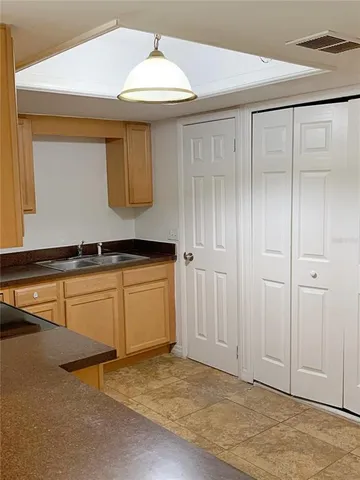 a kitchen with a sink and cabinets