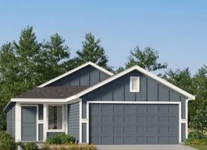 a view of a white house with large outdoor space and garden