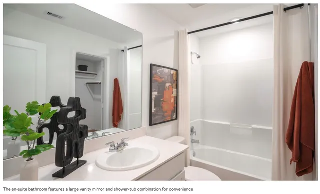 a view of a big room with wooden floor and windows