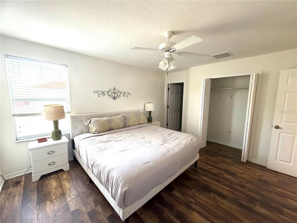 4573 Ada Lane Kissimmee, FL 34746 - Photo 18 of 37 a bedroom with a bed and a window