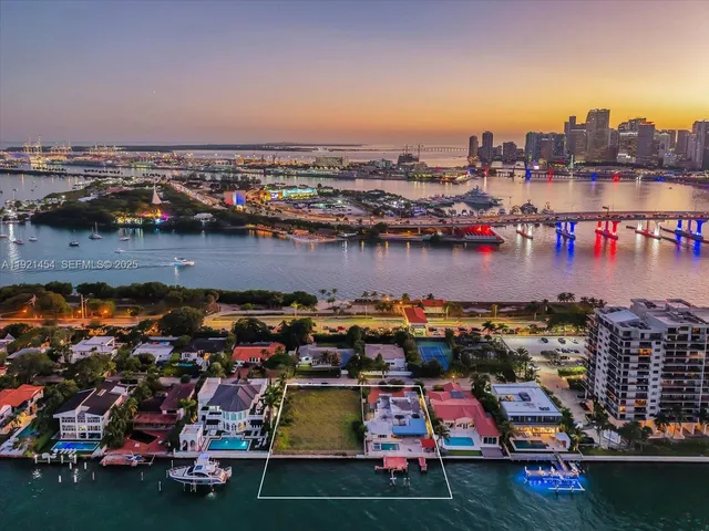 an aerial view of a city with lots of residential buildings ocean and ocean view