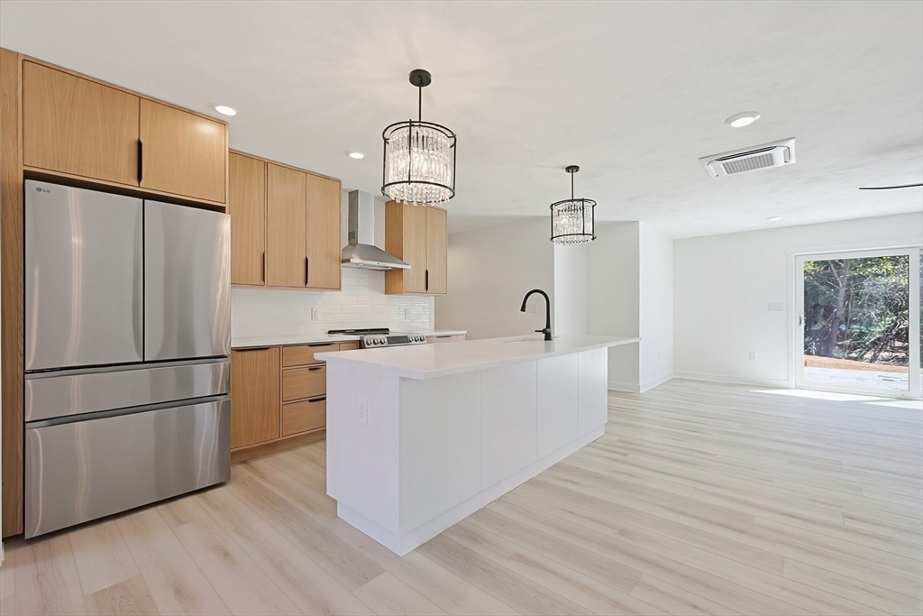 Lot 5 Pickering Road Blackstone, MA 01504 - Photo 11 of 31 a kitchen with stainless steel appliances a refrigerator a sink dishwasher and a stove with wooden floor