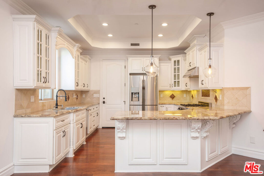 2005 Robinson Street, Unit B Redondo Beach, CA 90278 - Photo 11 of 46 a kitchen with stainless steel appliances granite countertop a sink a stove and a refrigerator