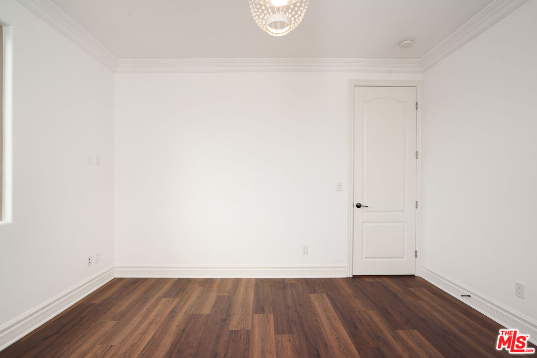 2005 Robinson Street, Unit B Redondo Beach, CA 90278 - Photo 35 of 46 a view of an empty room with wooden floor and a window