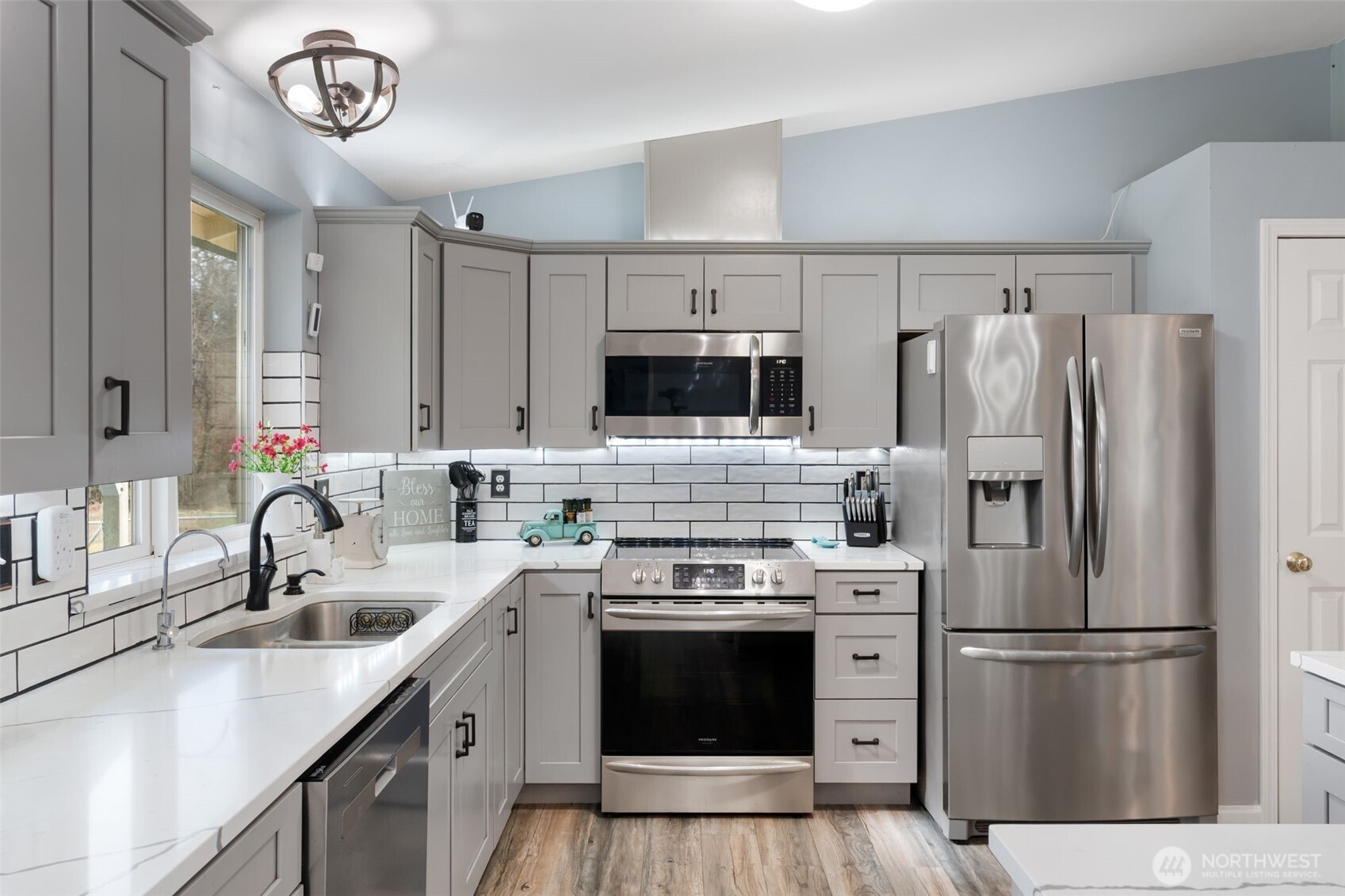 453 Coma Road Vader, WA 98593 - Photo 11 of 40 a kitchen with a refrigerator sink and stove
