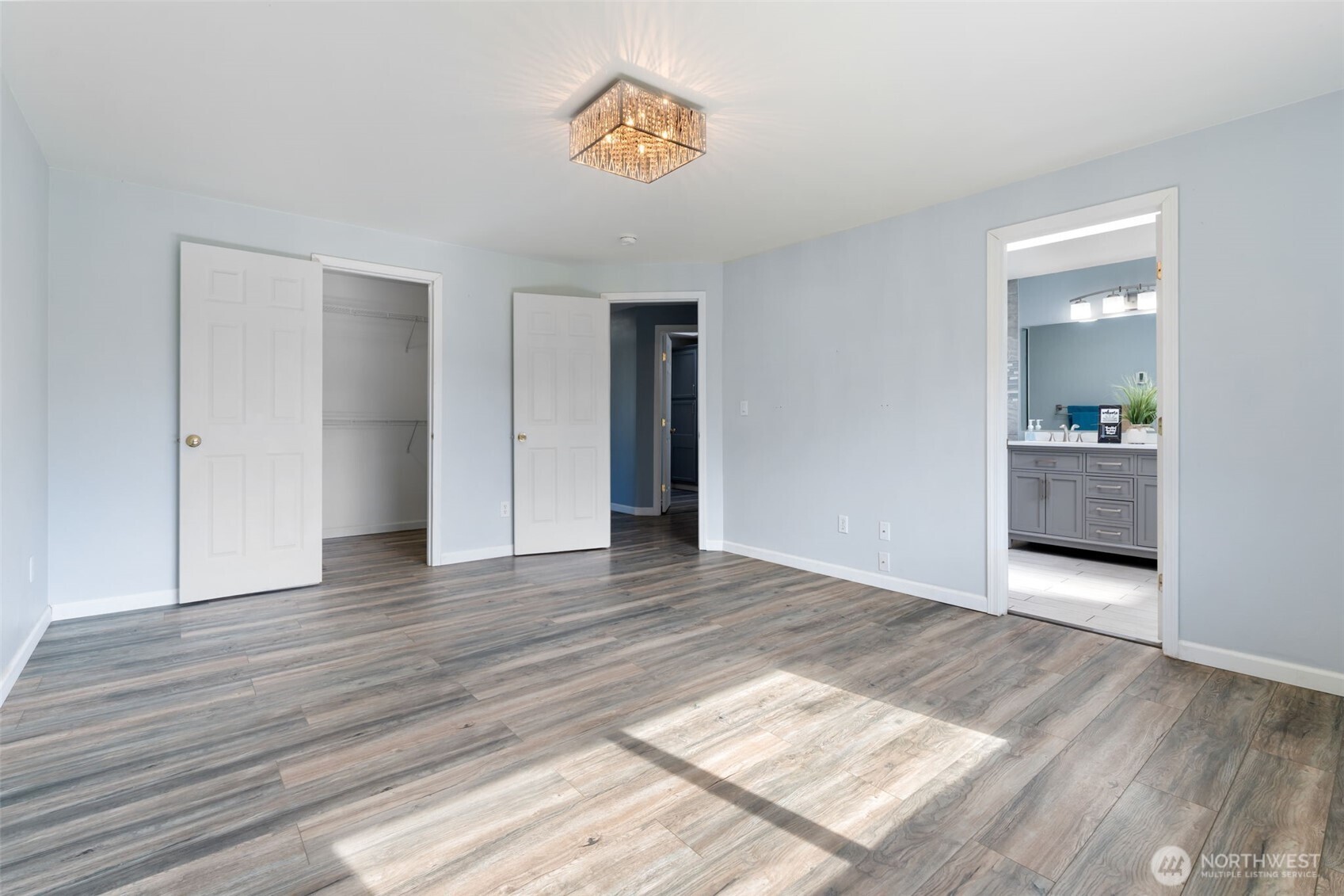453 Coma Road Vader, WA 98593 - Photo 17 of 40 an empty room with wooden floor and windows