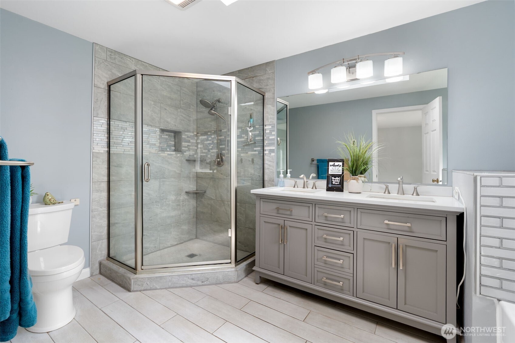 453 Coma Road Vader, WA 98593 - Photo 18 of 40 a bathroom with a shower a toilet a sink and mirror