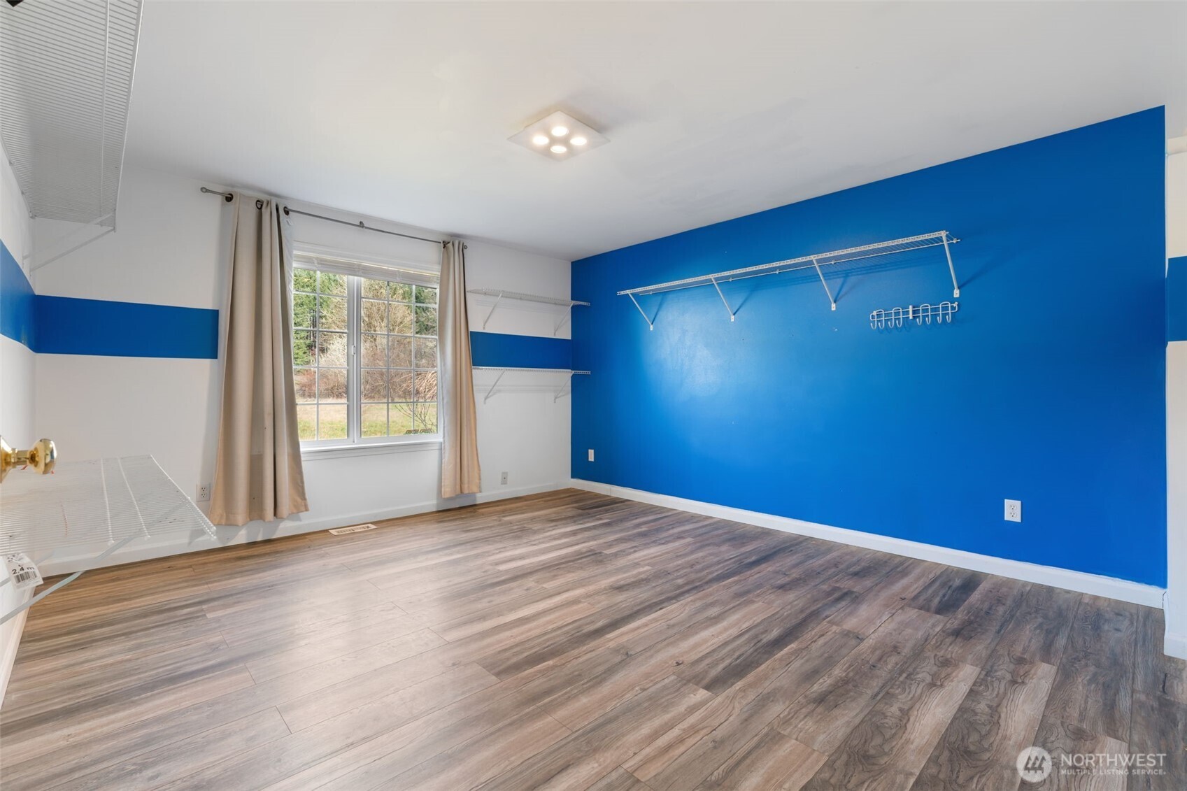 453 Coma Road Vader, WA 98593 - Photo 22 of 40 a view of empty room with wooden floor