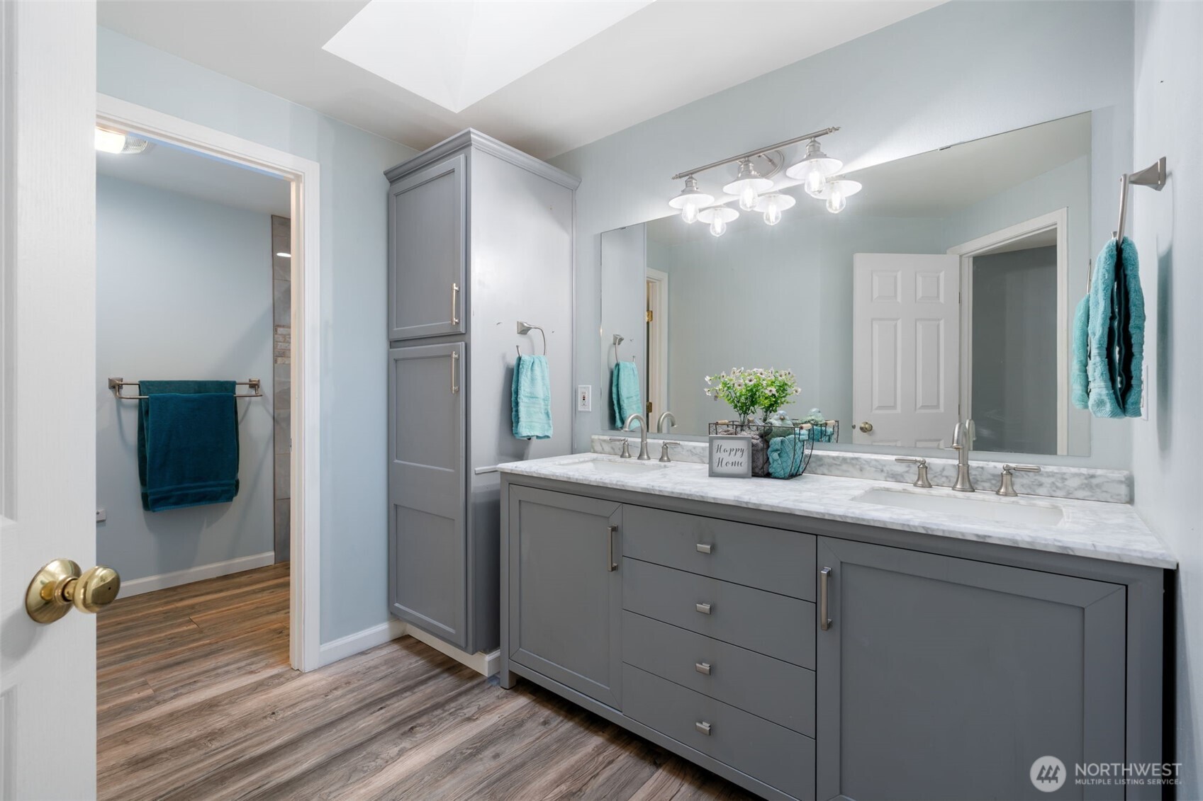 453 Coma Road Vader, WA 98593 - Photo 23 of 40 a bathroom with a double vanity sink and mirror