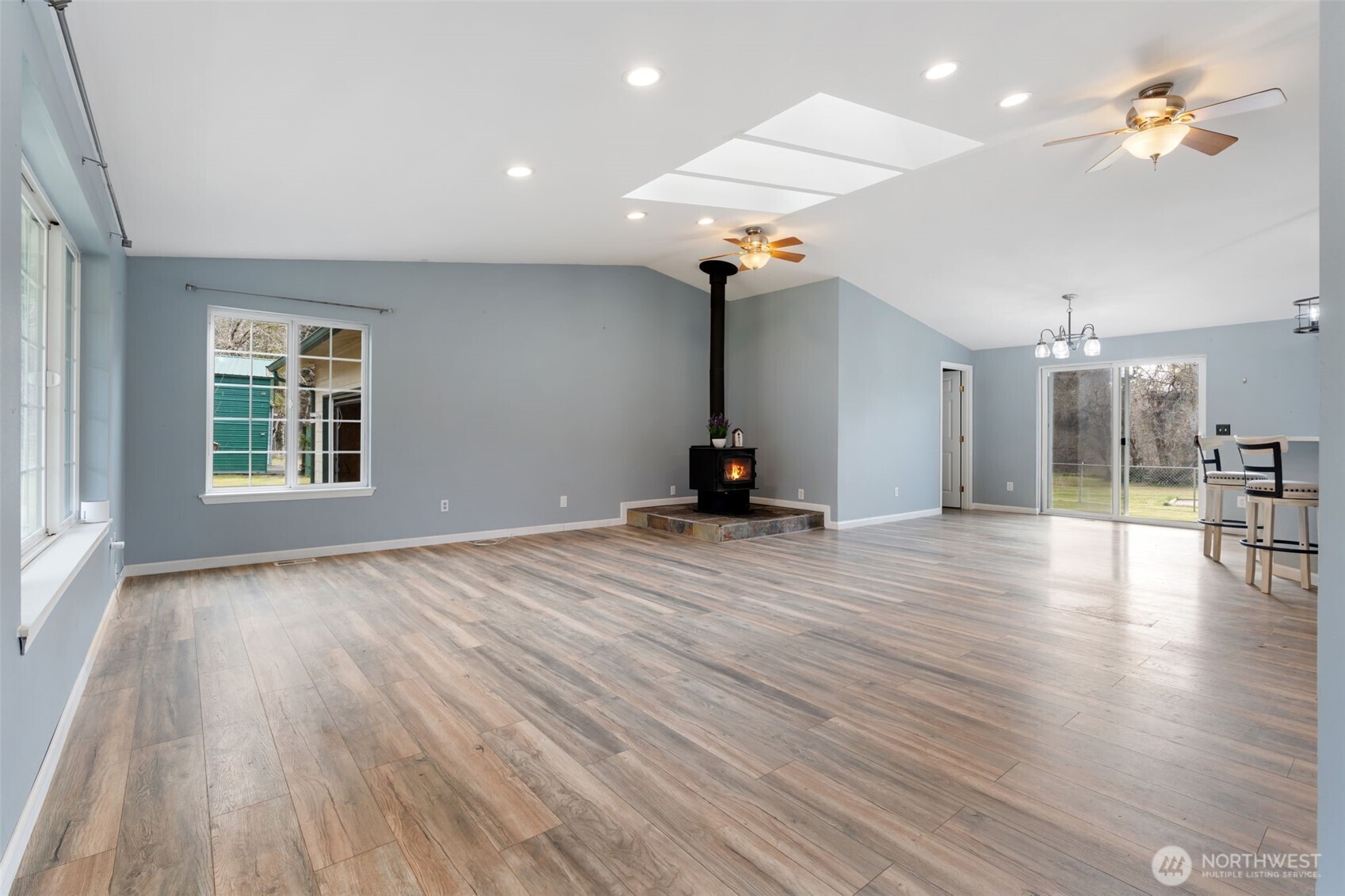 453 Coma Road Vader, WA 98593 - Photo 6 of 40 an empty room with wooden floor and windows