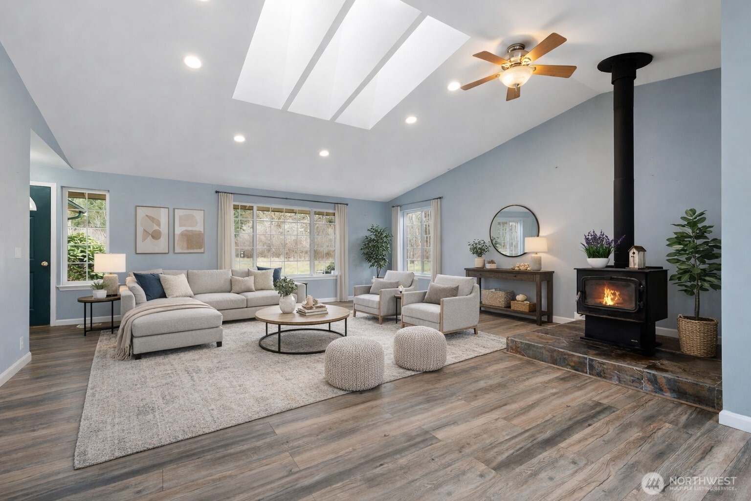 453 Coma Road Vader, WA 98593 - Photo 7 of 40 a living room with furniture a fireplace and a potted plant