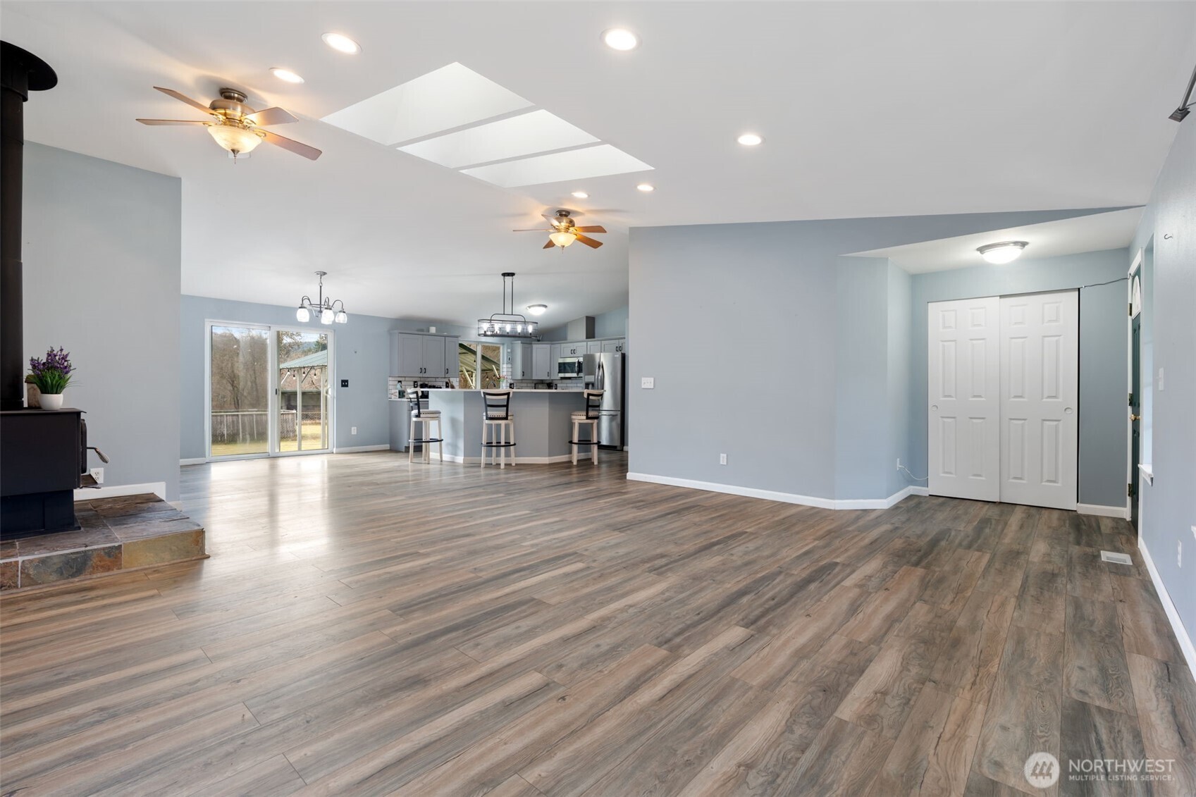 453 Coma Road Vader, WA 98593 - Photo 8 of 40 a view of a livingroom with a furniture wooden floor and a chandelier