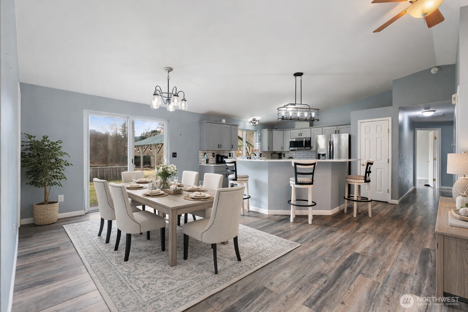 453 Coma Road Vader, WA 98593 - Photo 9 of 40 a view of a dining room with furniture and wooden floor