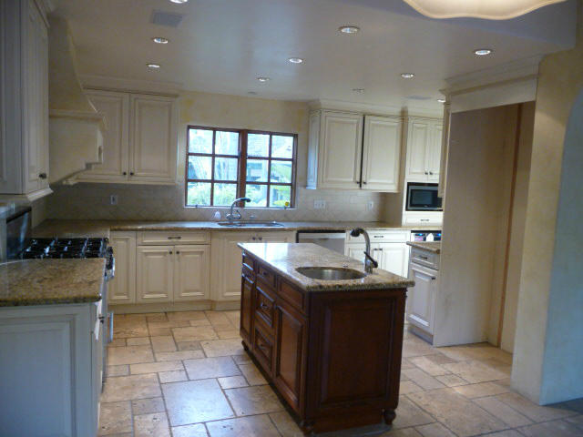 1845 Eucalyptus Hill Road Santa Barbara, CA 93108 - Photo 7 of 13 a kitchen with a stove sink and cabinets