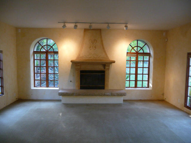 1845 Eucalyptus Hill Road Santa Barbara, CA 93108 - Photo 8 of 13 an empty room with windows and fireplace