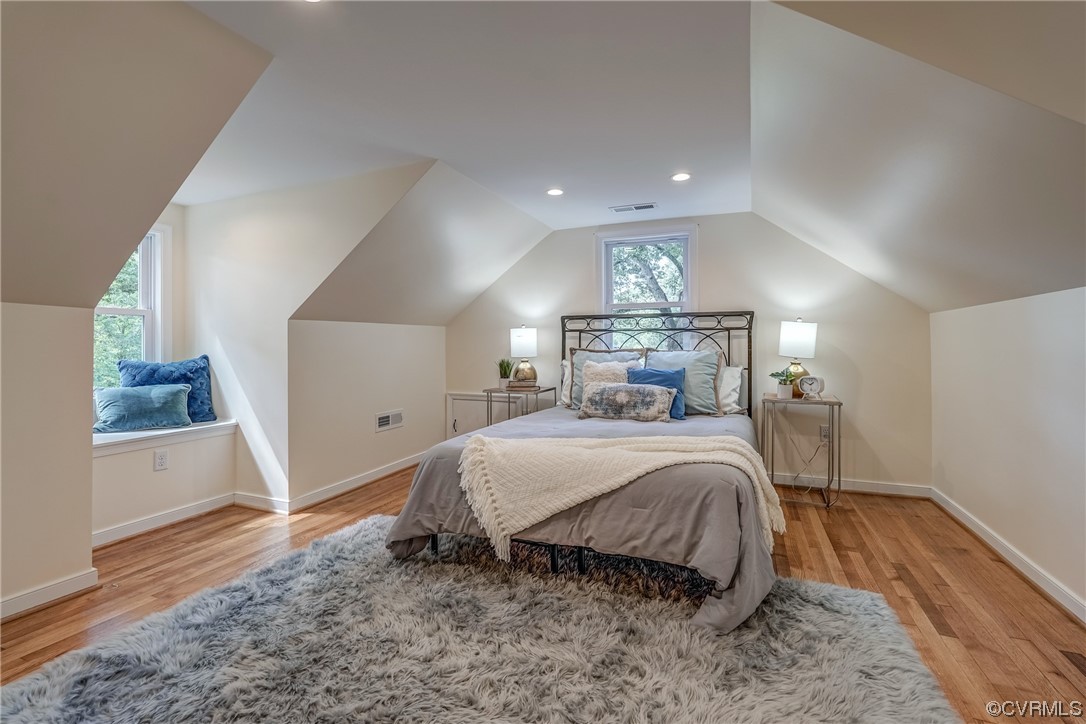 1289 Shallow Well Road Manakin-Sabot, VA 23103 - Photo 30 of 50 a bedroom with a large bed and a wooden floor
