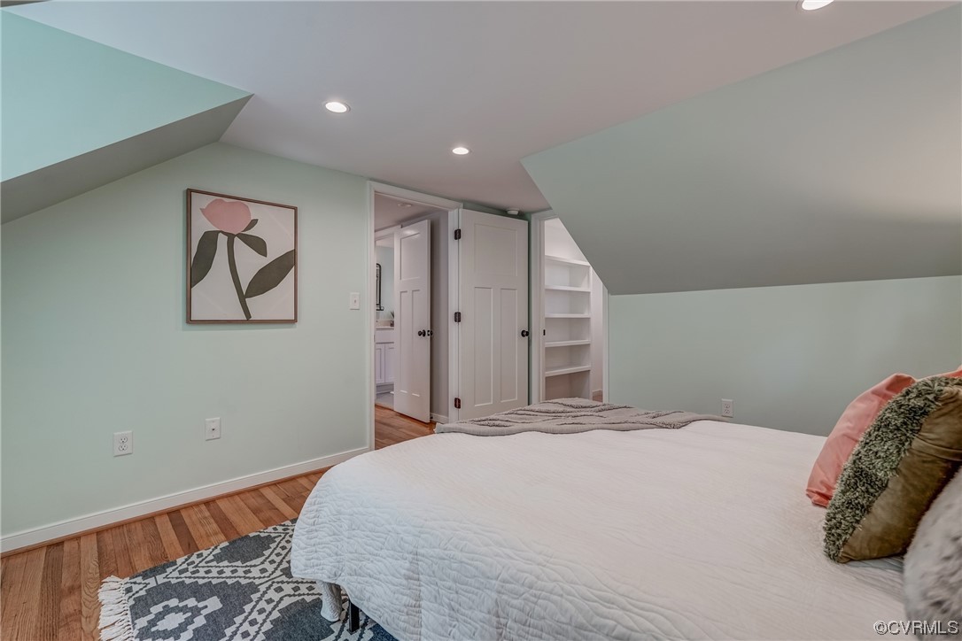 1289 Shallow Well Road Manakin-Sabot, VA 23103 - Photo 33 of 50 a bedroom with a large bed and a chandelier