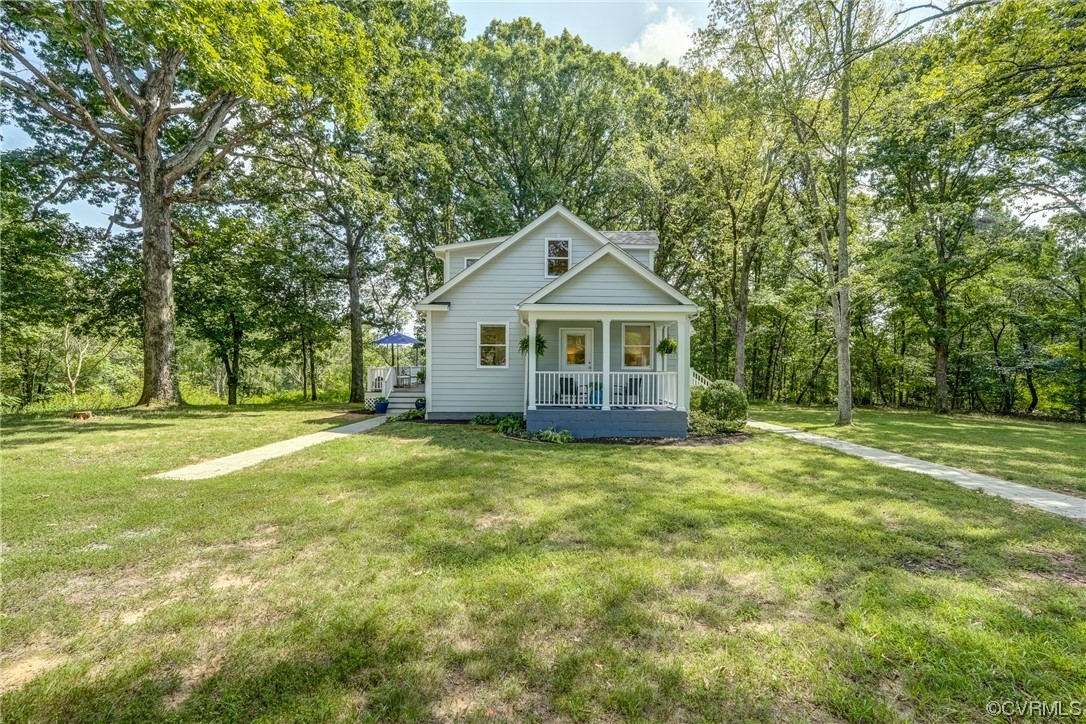 1289 Shallow Well Road Manakin-Sabot, VA 23103 - Photo 38 of 50 a front view of a house with a garden