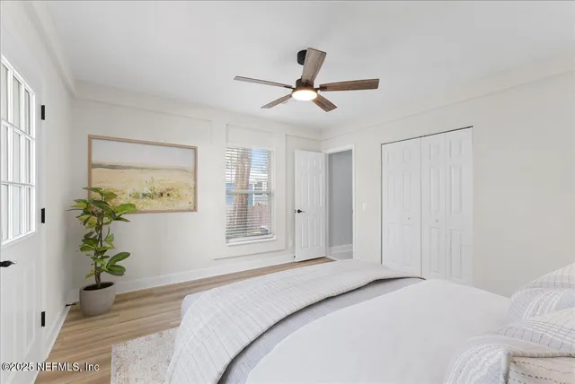 a bathroom with a granite countertop toilet sink and mirror