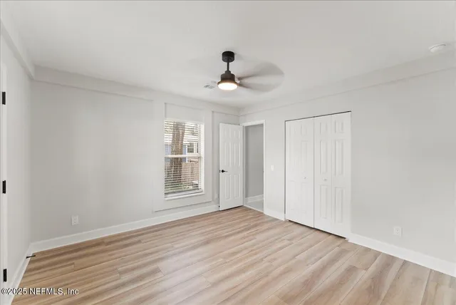 a front view of house with yard and trees around
