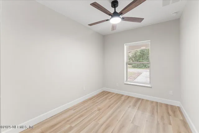 a house that has a tree in front of it