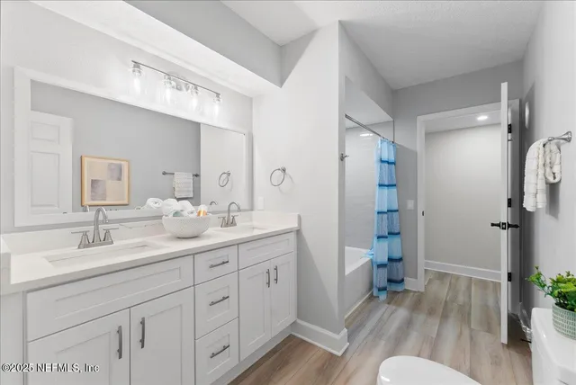 a front view of multiple houses with yard