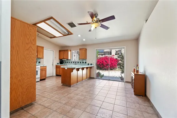 a view of living room with kitchen furniture and flat screen tv