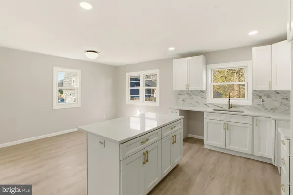 a bathroom with a sink and a window
