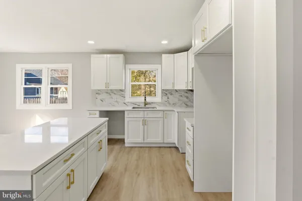 a view of an empty room and a window