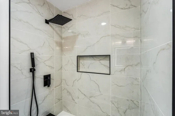 a view of a room with wooden floor and windows