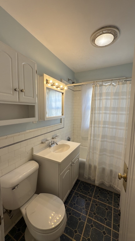 56 Union Street, Unit 2 Boston, MA 02135 - Photo 15 of 17 a bathroom with a sink a toilet and shower