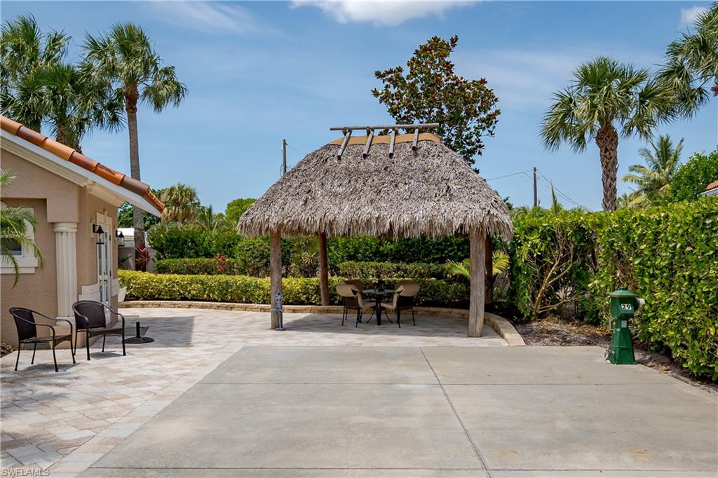 13419 Snook Circle Naples, FL 34114 - Photo 20 of 34 a view of garden with patio