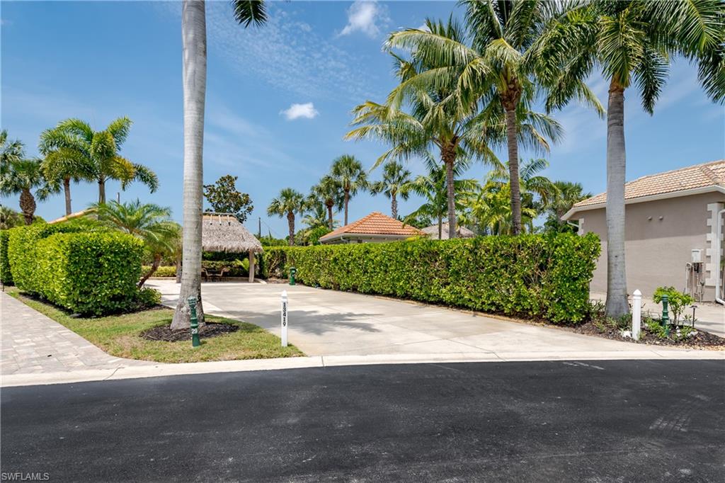 13419 Snook Circle Naples, FL 34114 - Photo 21 of 34 a view of a street with potted plants