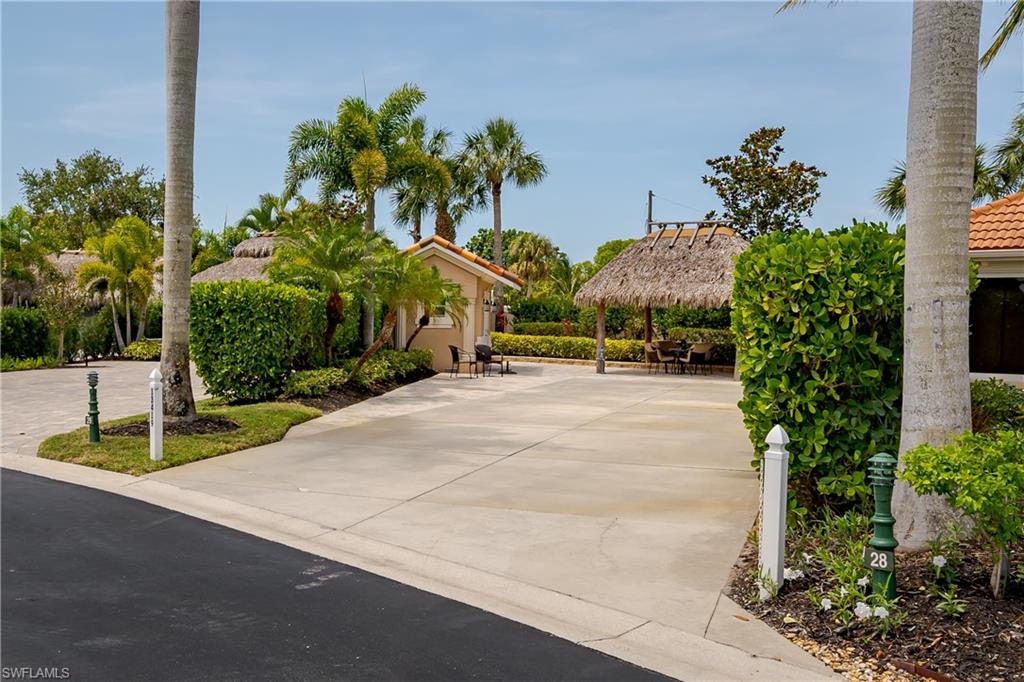 13419 Snook Circle Naples, FL 34114 - Photo 25 of 34 a view of a street with a fountain