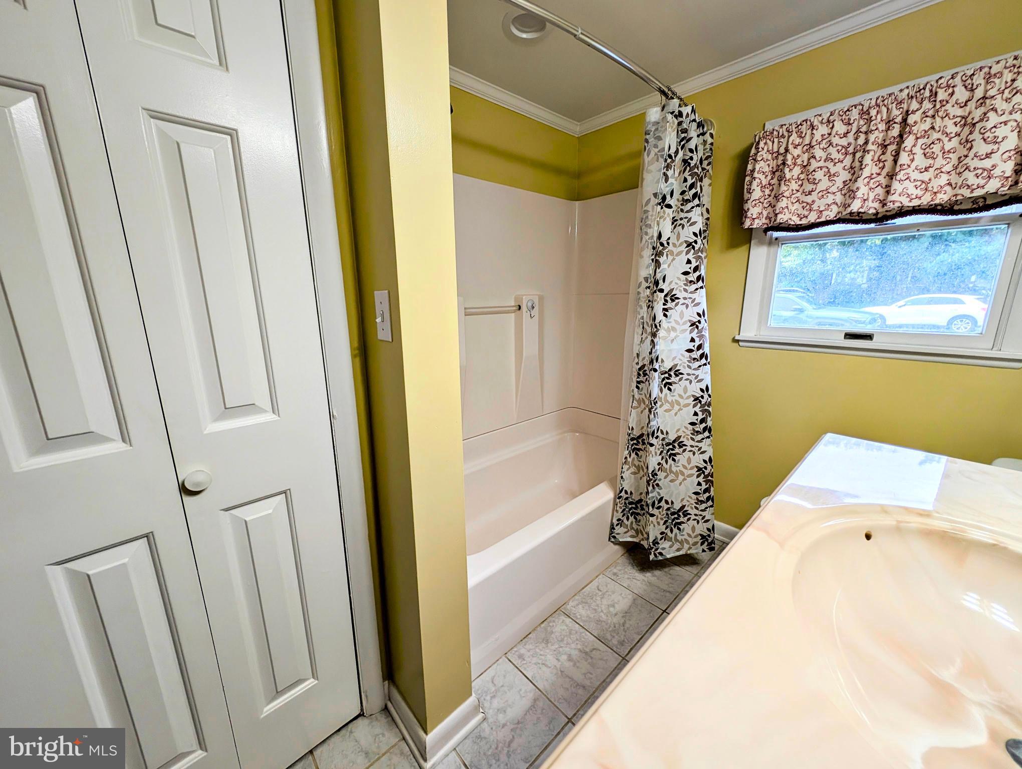 134 Captains Quarters Road, Unit 5 Ocean City, MD 21842 - Photo 14 of 26 a bathroom with a tub and shower