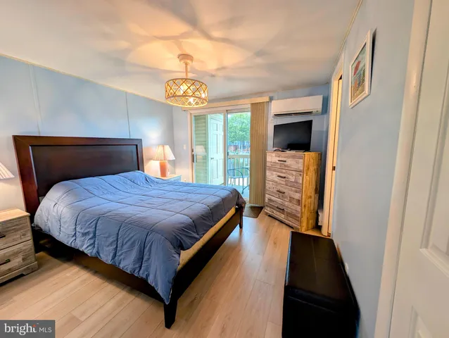 a bedroom with a bed and a walk in closet