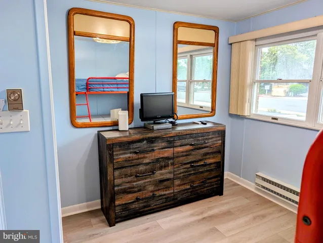 a view of room with window and bathroom