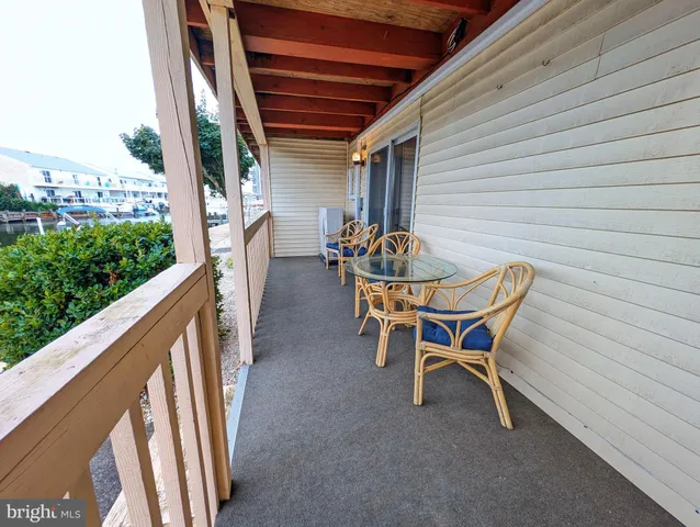a patio with table and chairs