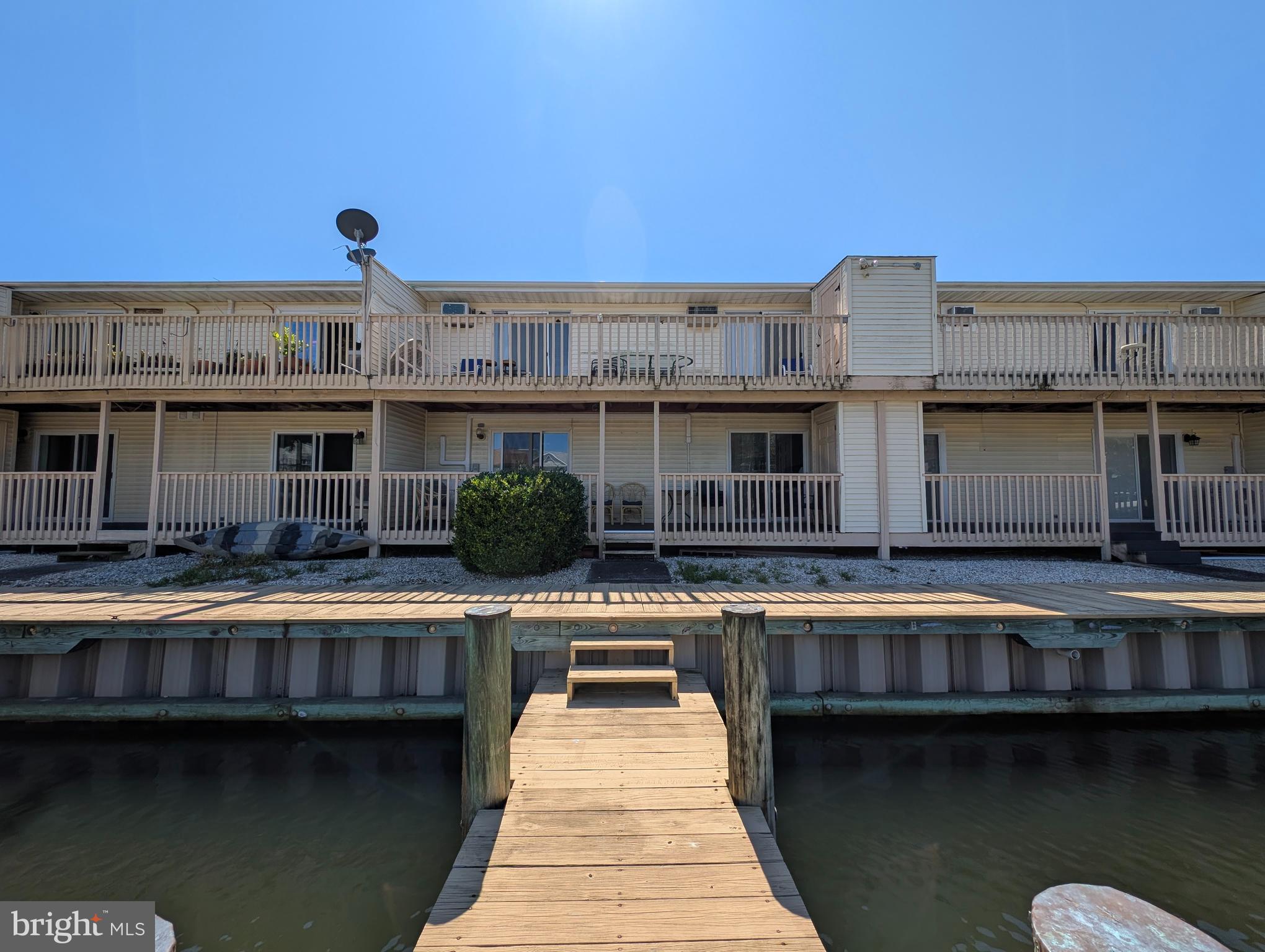 134 Captains Quarters Road, Unit 5 Ocean City, MD 21842 - Photo 3 of 26 a view of a swimming pool with deck