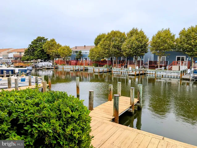 a view of a lake with a house next to a lake
