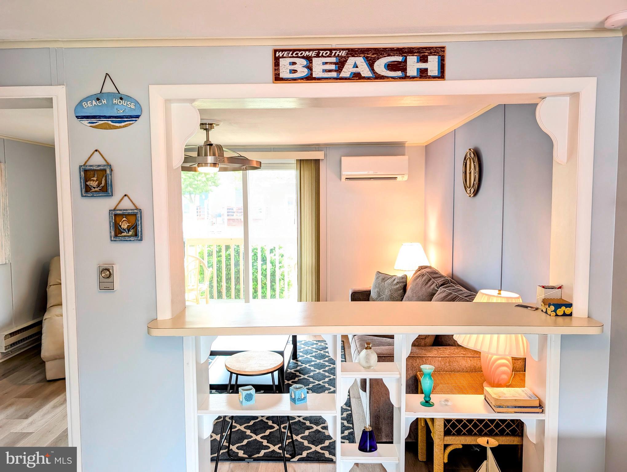 134 Captains Quarters Road, Unit 5 Ocean City, MD 21842 - Photo 6 of 26 a bedroom with a bed and a window