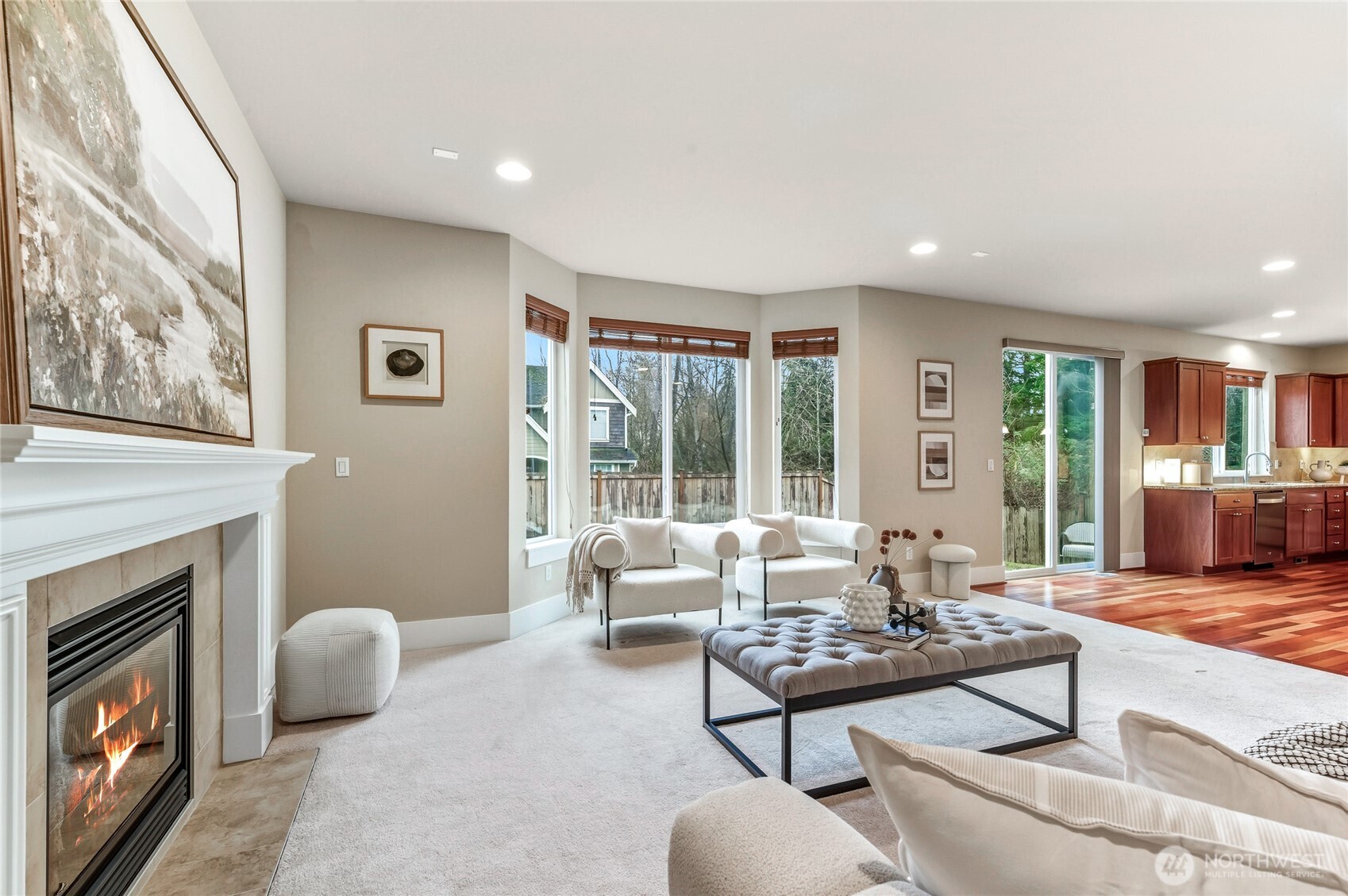 5205 Northeast 10th Street Renton, WA 98059 - Photo 11 of 28 a living room with furniture a rug and a fireplace